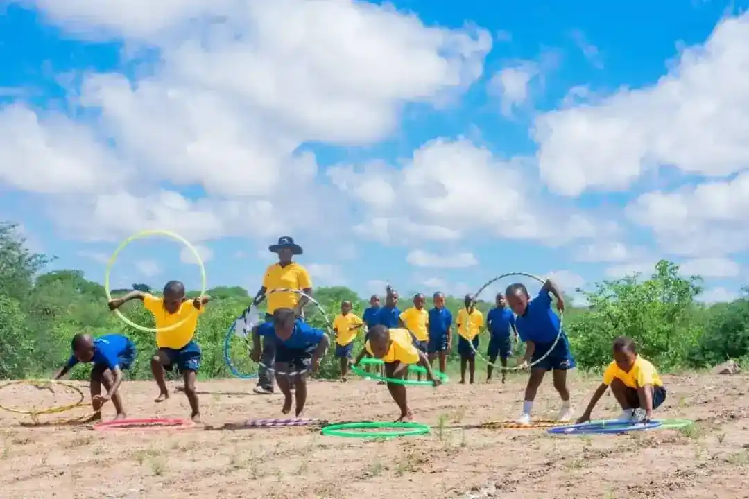 Children playing with hula hoops in movement class