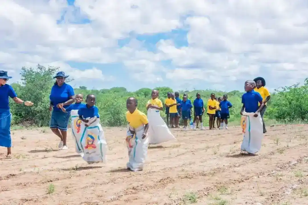 Children competing in a sack race outdoor activity
